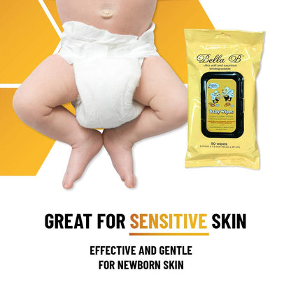 Baby in diaper with Bella B baby wipes packaging 