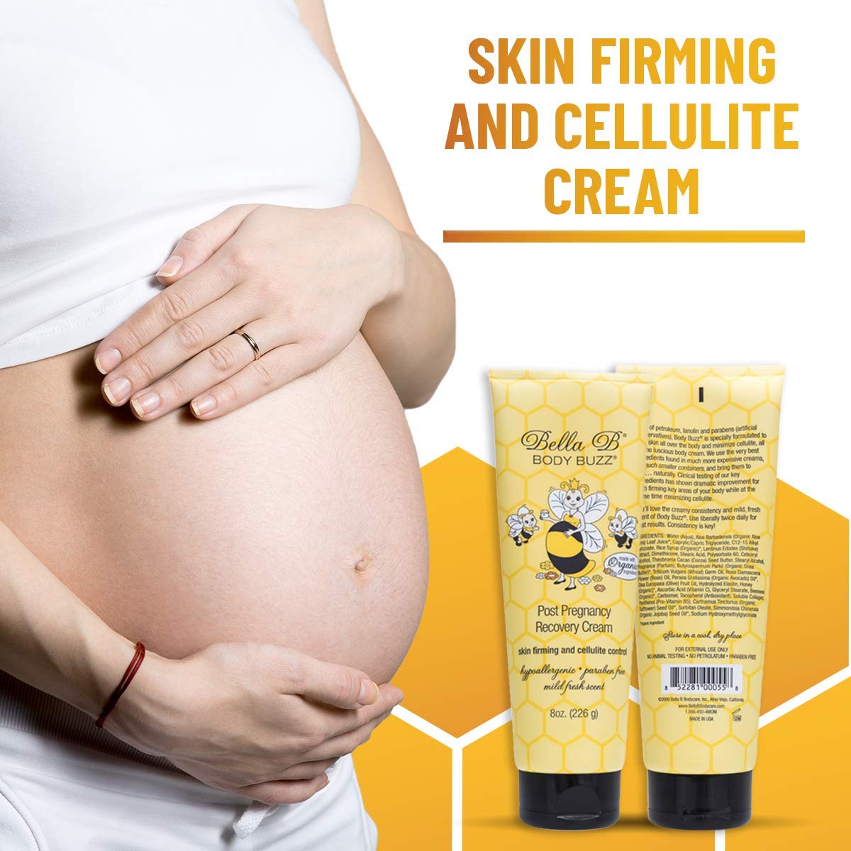 Pregnant woman holding her belly with a tube of Bella B Body Buzz Skin Firming and Cellulite Cream