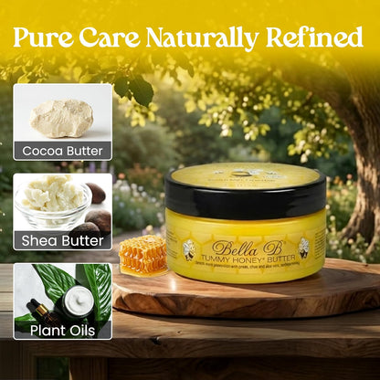 Yellow jar of Bella B Tummy Honey Butter with natural ingredients displayed on a wooden surface.