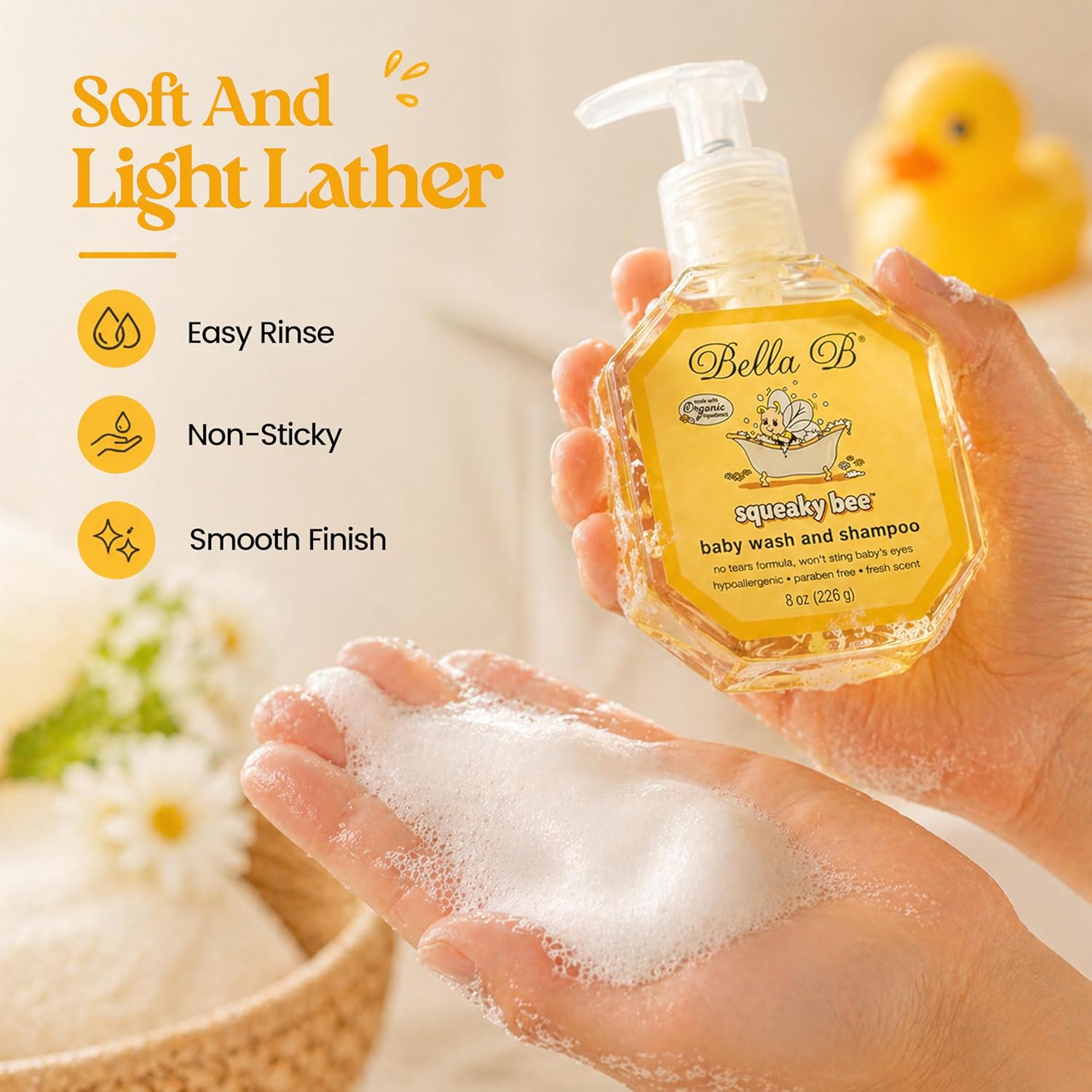 Bella B baby wash and shampoo bottle with a hand holding lathered soap, featuring product benefits.