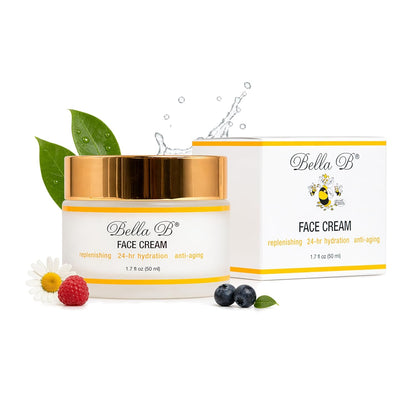 Bella B face cream jar and packaging on a white background with green leaves and berries.
